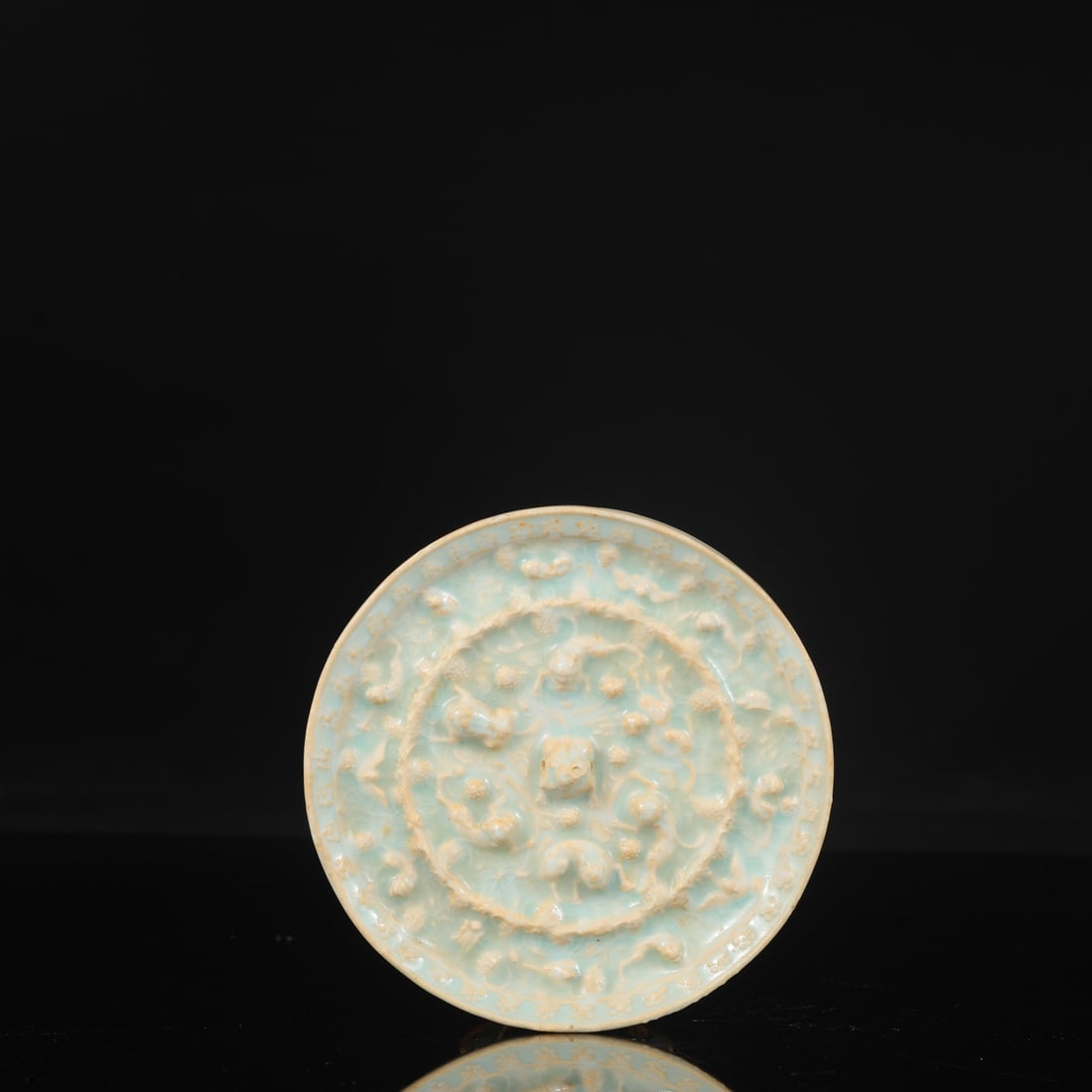 A Southern Song Dynasty Hutian Kiln celadon auspicious beast mirror from the collection. (1 of 6)