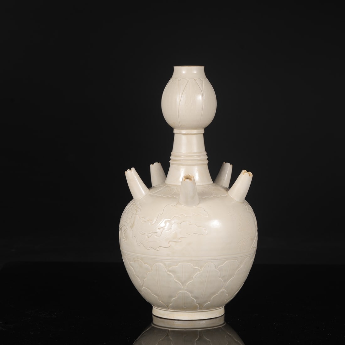 A large Northern Song Dynasty Ding ware white-glazed vase with carved banana leaf and phoenix (1 of 8)