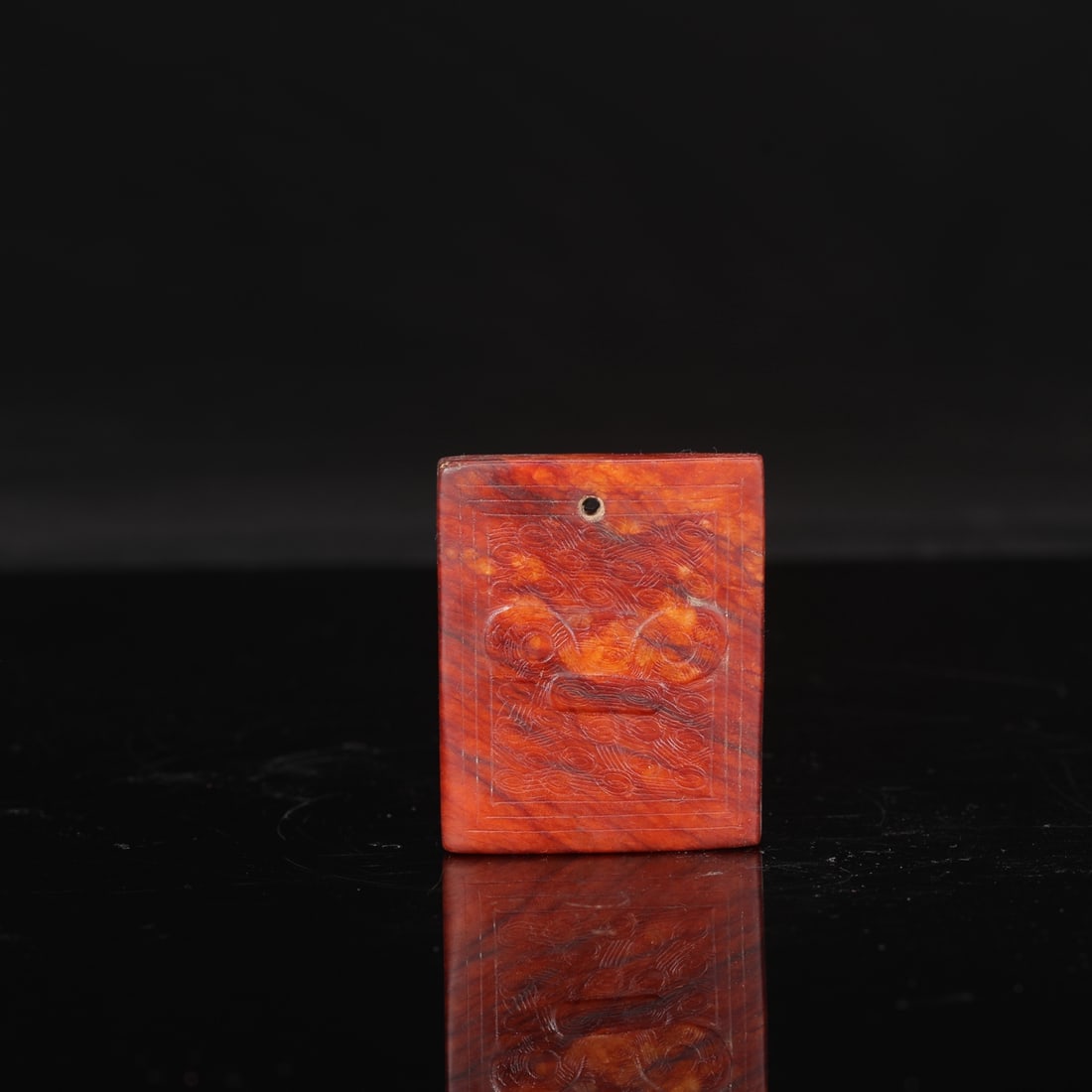 A square jade pendant with animal mask design from the Liangzhu culture, formerly in the collection.: Length: 7 cm, Width: 5.5 cm