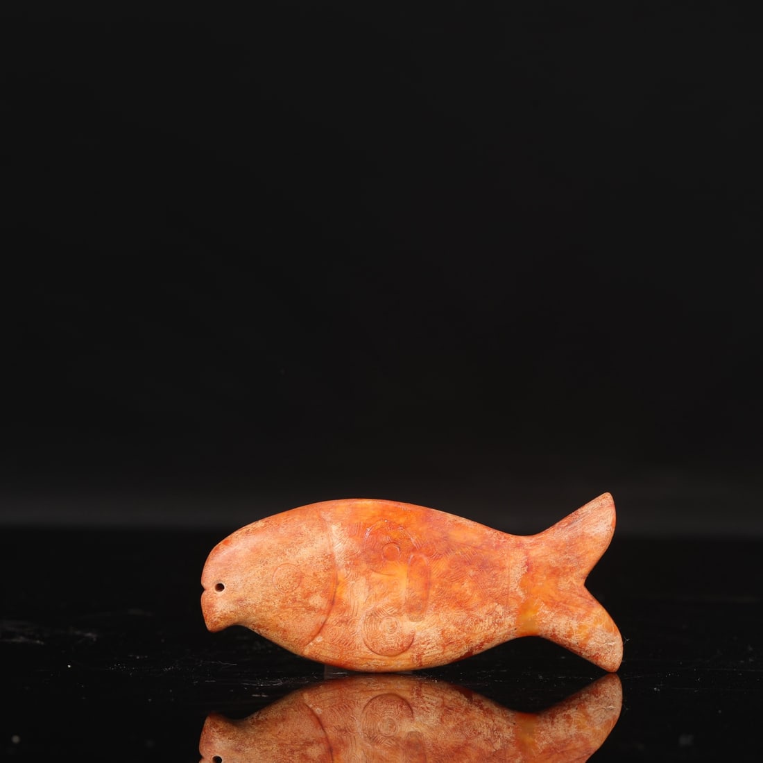 Jade fish pendant with animal mask design from the Liangzhu culture (formerly in the collection).: Length: 11.5 cm, Width: 5 cm