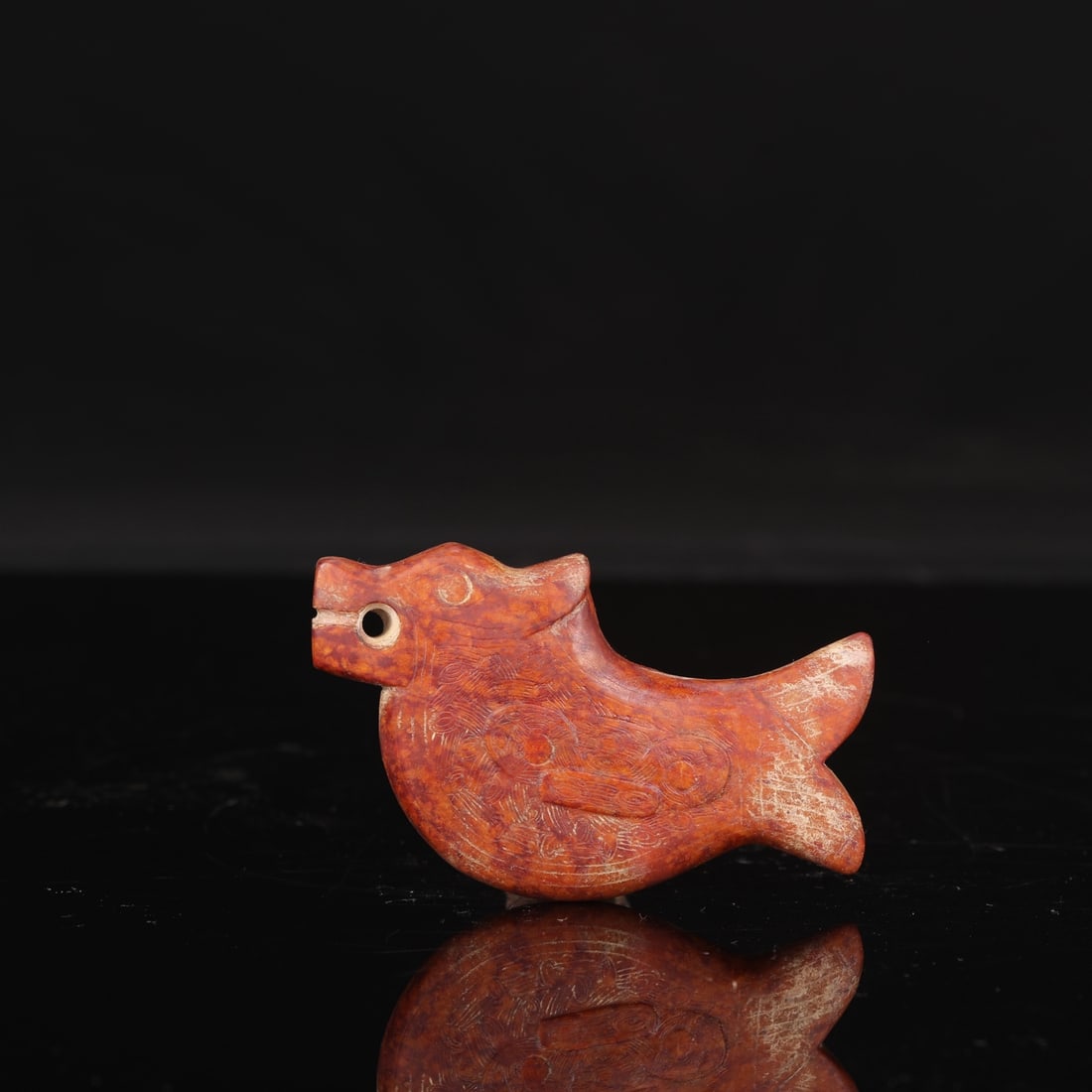 A Liangzhu culture jade pendant with animal mask and fish-dragon motif, formerly in the collection.: Length: 10.5 cm, Width: 6.5 cm