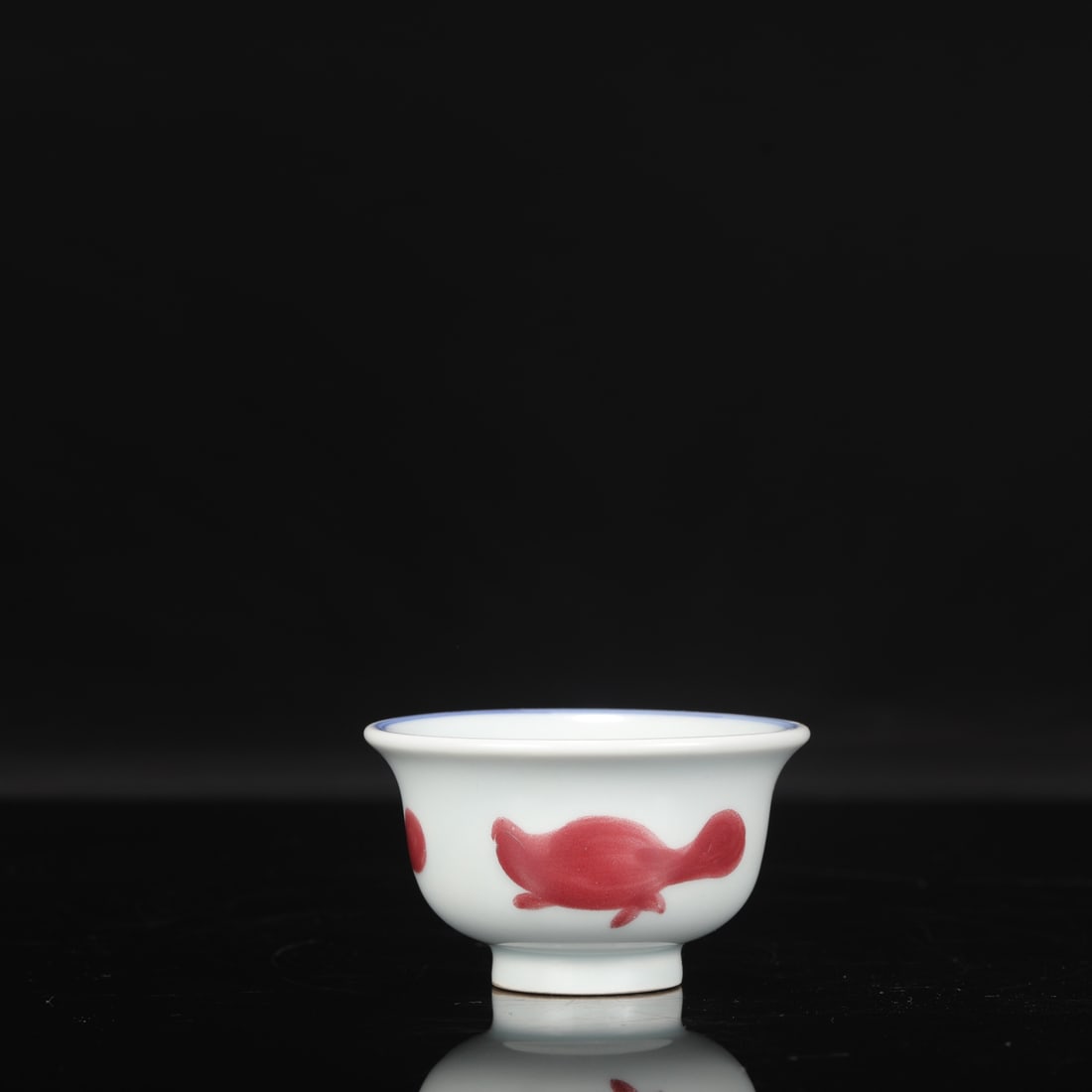 Formerly in the collection, a Ming Dynasty Yongle period blue and white underglaze red: Height: 5 cm, Mouth diameter: 9 cm