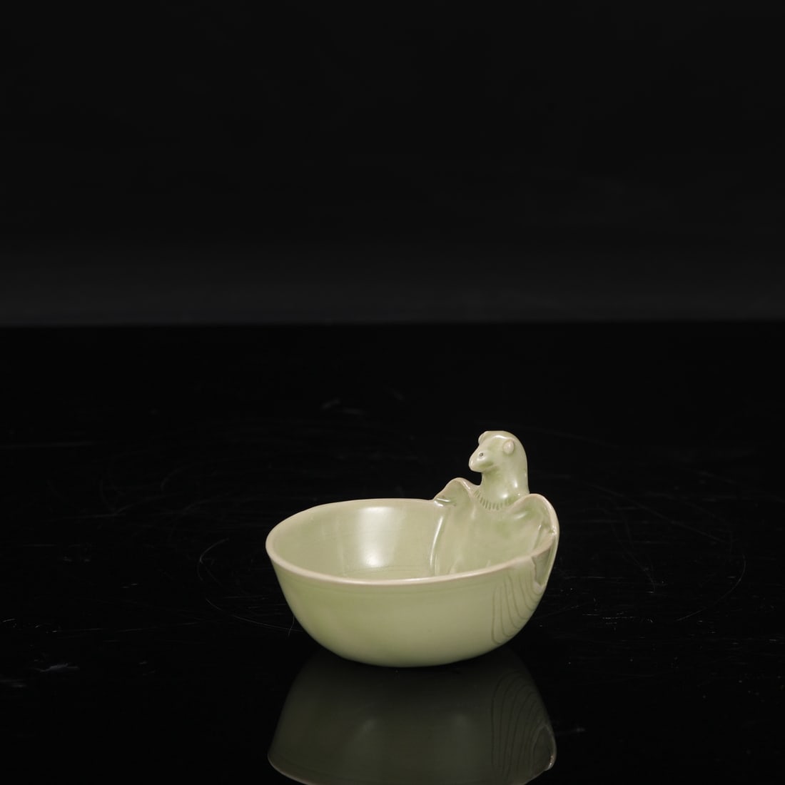 A Tang Dynasty Yue ware celadon parrot-shaped washer, formerly in the collection. (1 of 8)
