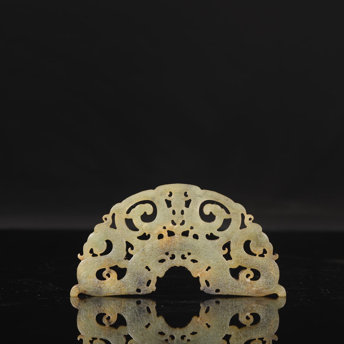 A Warring States period openwork jade pendant with dragon and phoenix design.: Length: 12 cm, Width: 6.5 cm