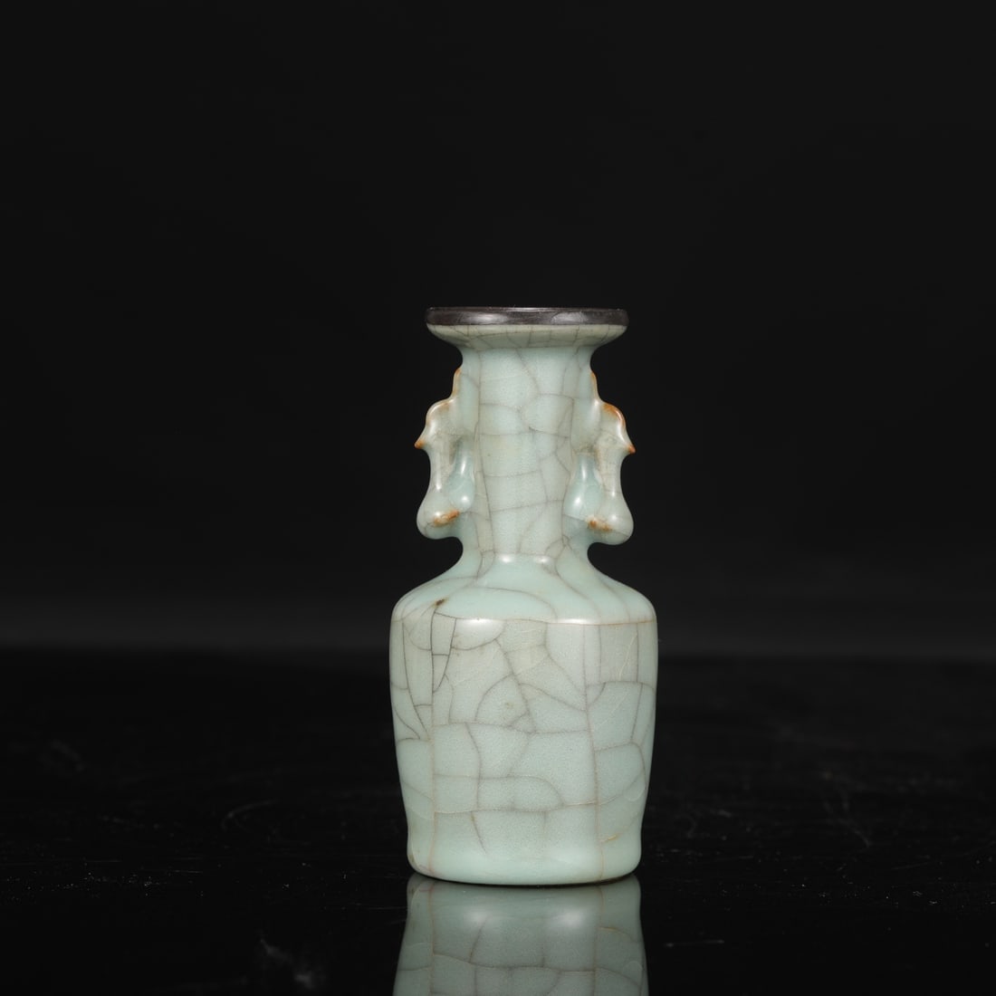 A Southern Song Dynasty official kiln celadon vase with silver rim and phoenix-shaped handles,: Height: 12 cm, Mouth diameter: 4 cm, Belly diameter: 5.5 cm