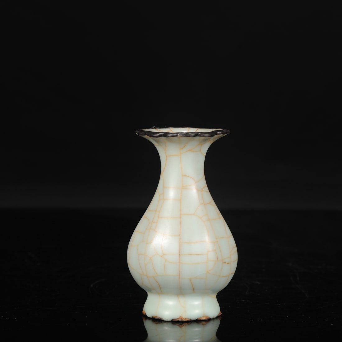 A Southern Song Dynasty official kiln celadon melon-shaped vase with a silver rim, formerly in the (1 of 7)
