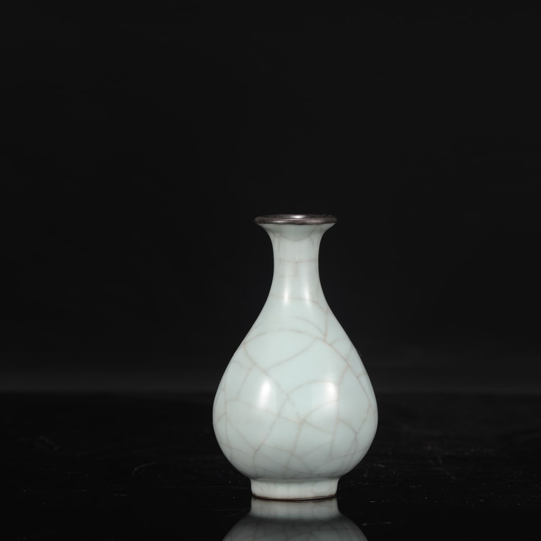 A Southern Song Dynasty official kiln celadon vase with a silver mouth, formerly in the collection,: Height: 12 cm, Mouth diameter: 3.5 cm, Belly diameter: 7 cm