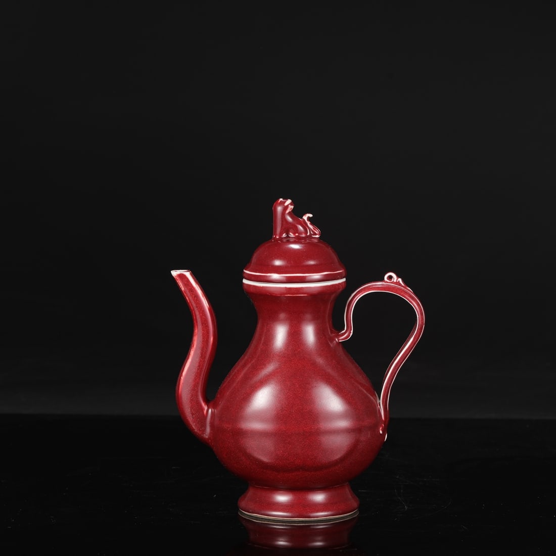 A large Ming Dynasty Xuande period ruby-red glazed ewer, formerly in the collection.: Height: 23 cm, Mouth diameter: 7.5 cm, Belly diameter: 11.5 cm