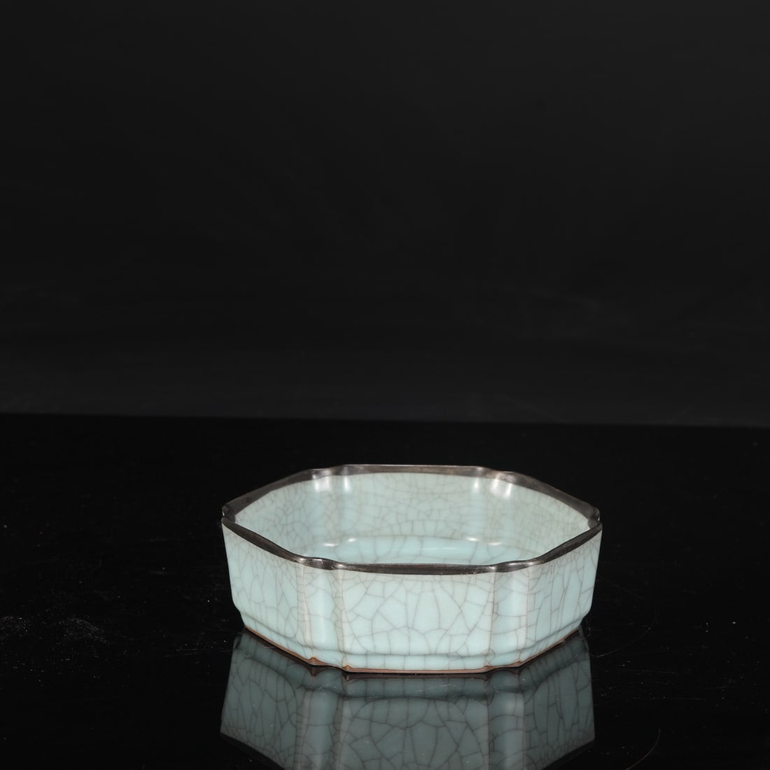 A Southern Song Dynasty official kiln celadon hexagonal dish with a silver rim, formerly in the: Height: 5.5 cm, Mouth Diameter: 16.5 cm