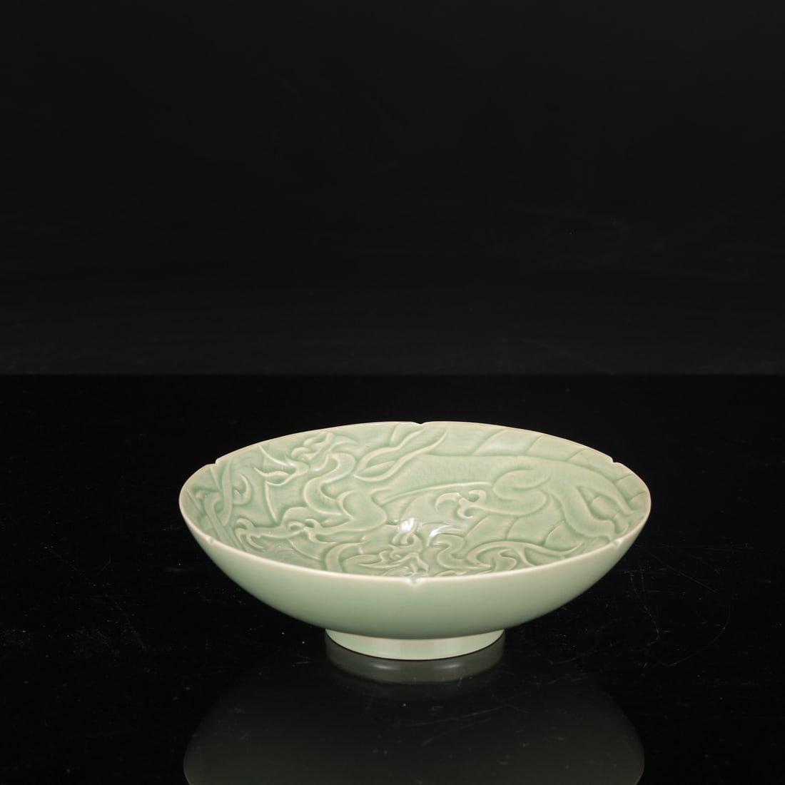 A large Tang Dynasty Yue ware celadon bowl with carved dragon design, formerly in the collection.: Height: 5 cm, Diameter: 20 cm