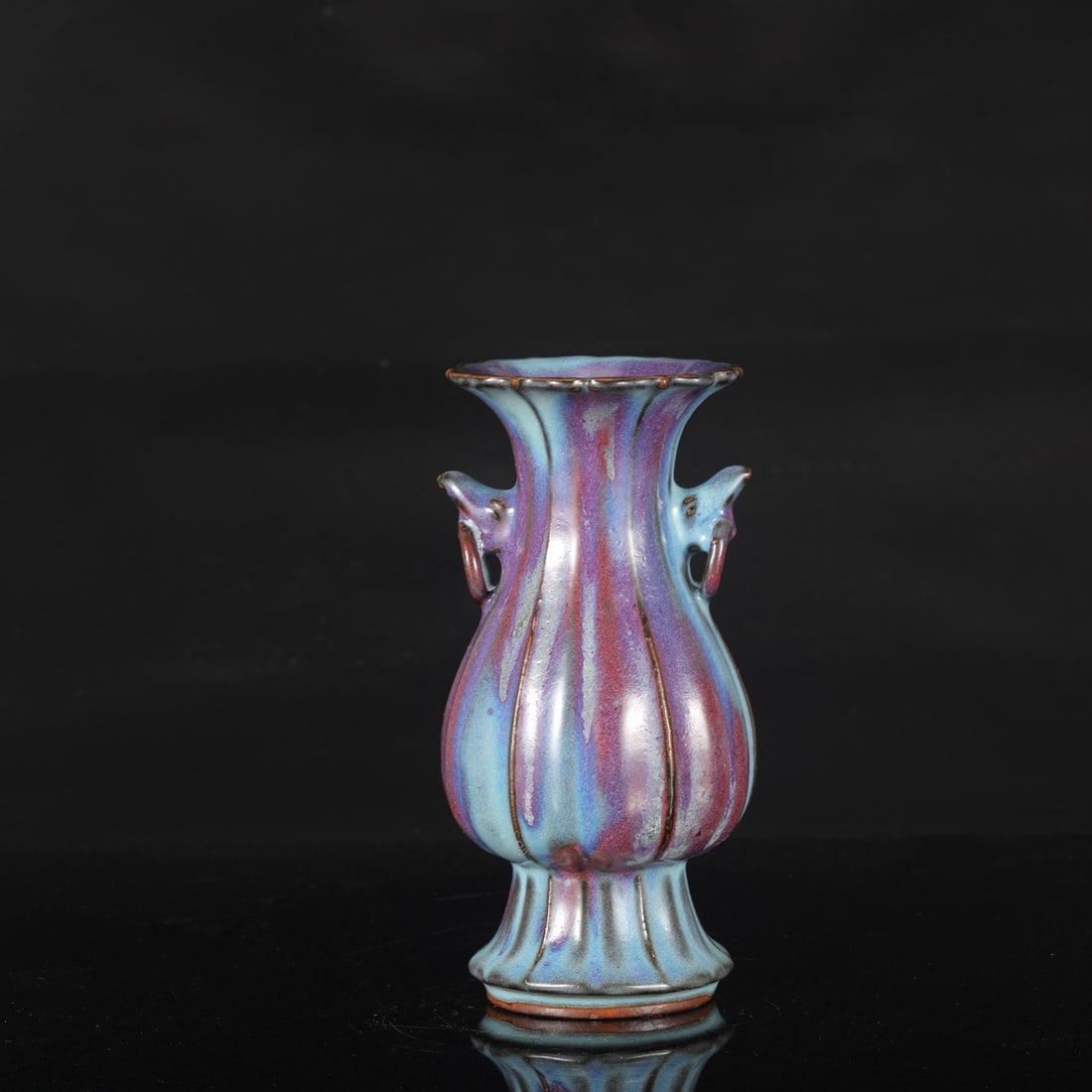 A Northern Song Dynasty Jun ware melon-shaped vase with purple-red spots and elephant-ear handles,: Height: 22.5 cm, Mouth diameter: 10 cm, Belly diameter: 11 cm