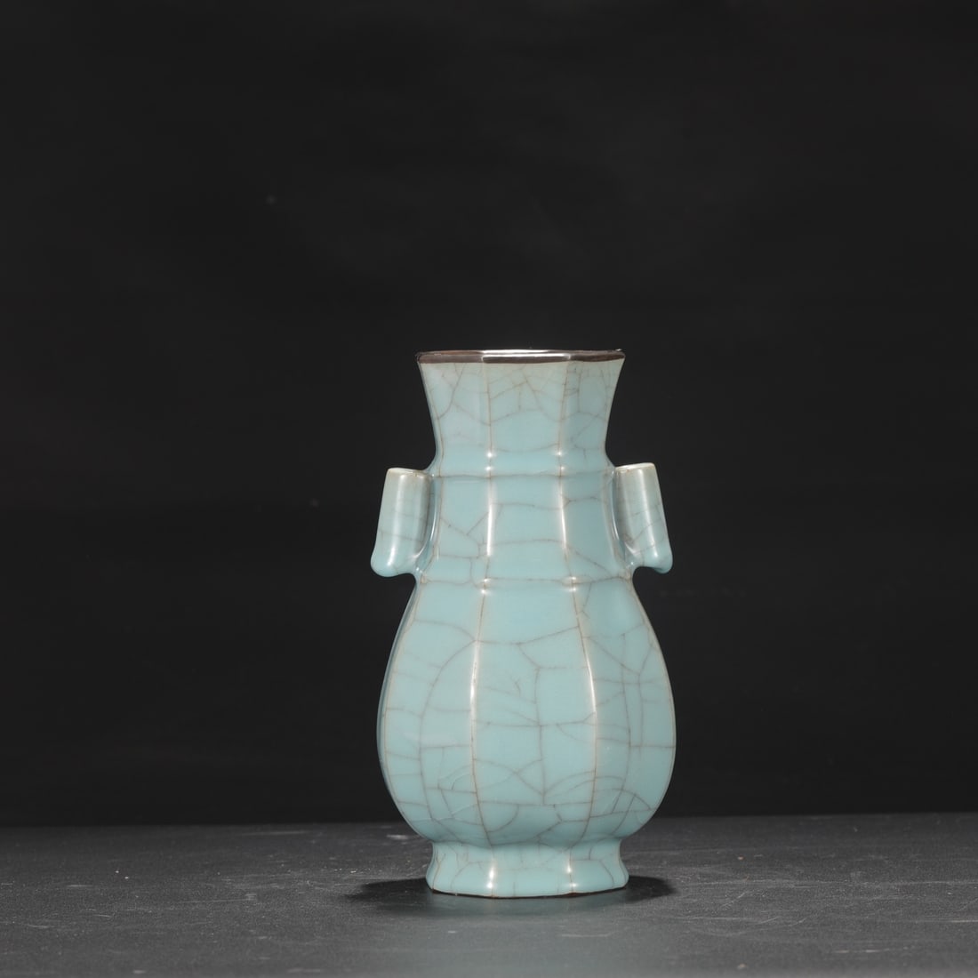A Southern Song Dynasty official kiln celadon vase with silver rim and tubular handles, formerly in: Height: 22 cm, Mouth diameter: 8.5 cm, Belly diameter: 12 cm