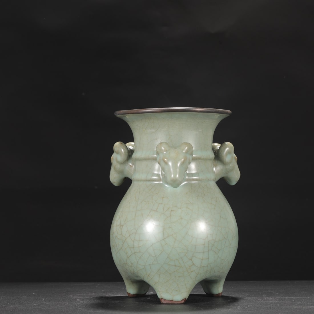 A Southern Song Dynasty official kiln celadon vase with a silver rim and three rams, inscribed with: Height: 25 cm, Belly diameter: 16 cm, Mouth diameter: 7 cm