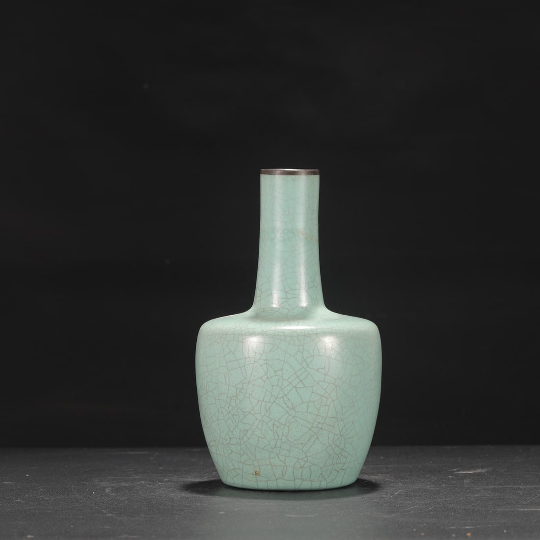 A Northern Song Dynasty Ru ware celadon-glazed silver-rimmed paper-shaped vase from a former: Height: 22.3 cm, Mouth diameter: 4 cm, Belly diameter: 12.5 cm