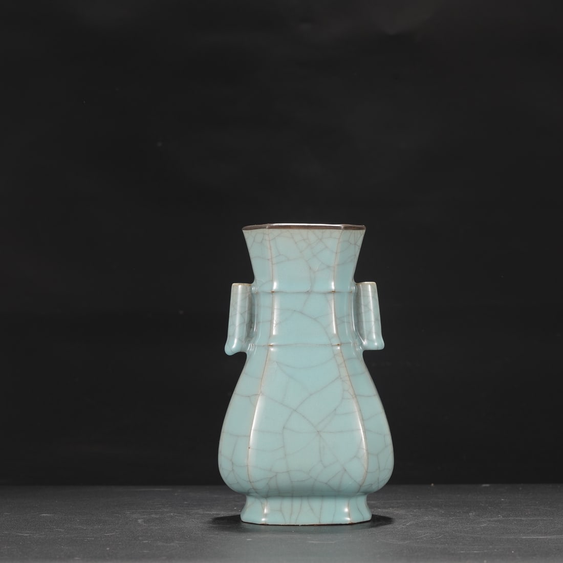 A Southern Song Dynasty official kiln celadon vase with silver rim and tubular handles, inscribed: Height: 22 cm, Mouth diameter: 9 cm, Belly diameter: 12.5 cm