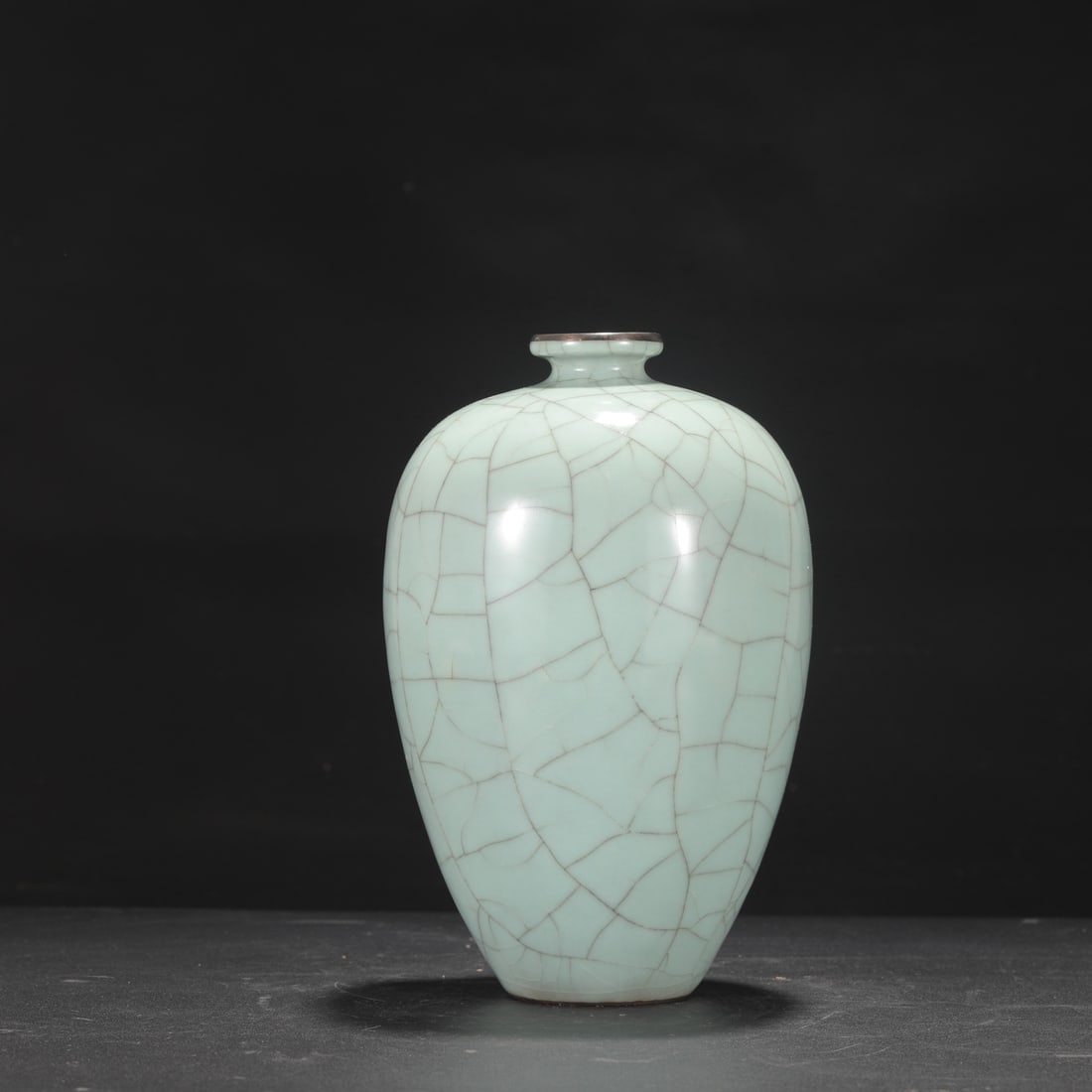 A large Southern Song Dynasty official kiln celadon plum vase with a silver rim, formerly in the: Height: 23.5 cm, Mouth diameter: 4.5 cm, Belly diameter: 14.5 cm