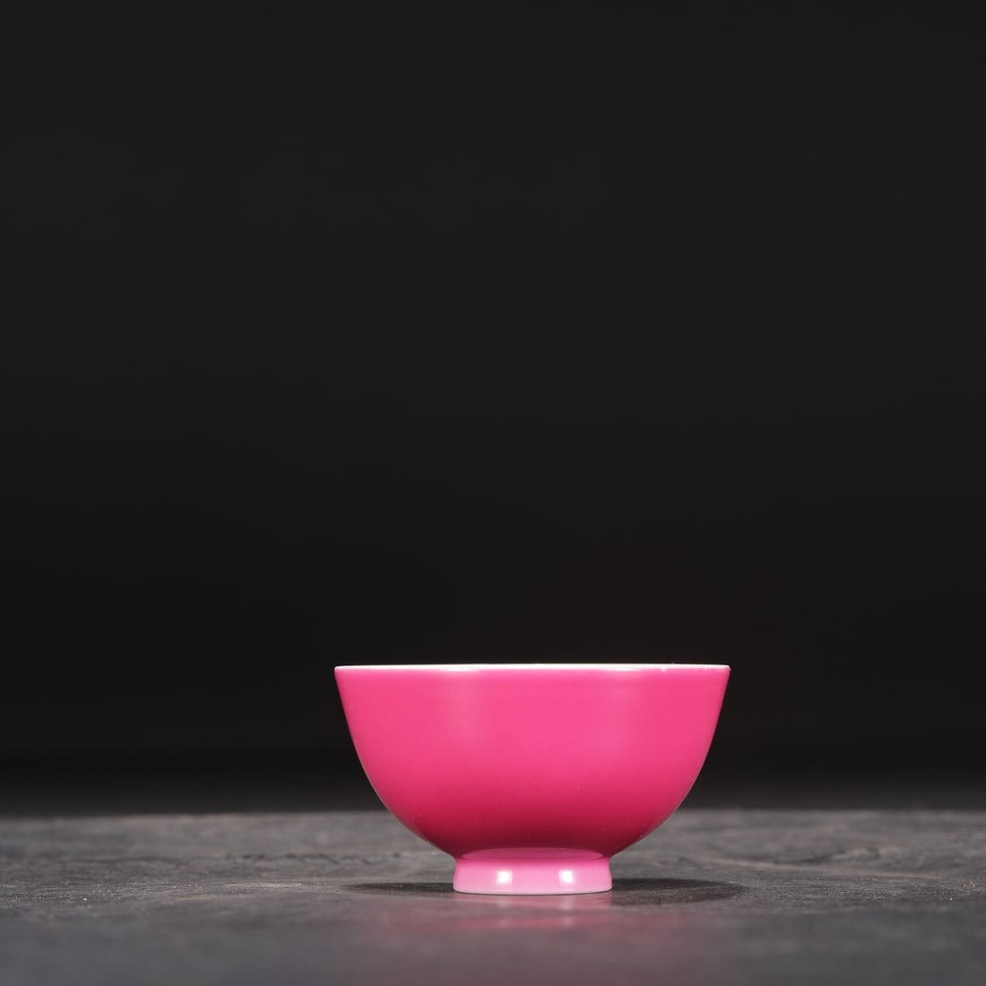 A Qing Dynasty Yongzheng period rouge-red glazed tea bowl, formerly in the collection.: Height: 4.5 cm, Mouth Diameter: 7.5 cm