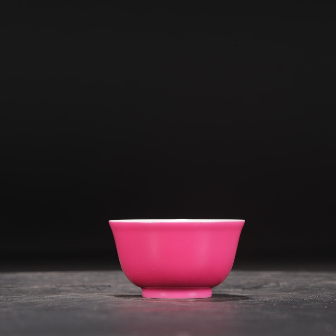A Qing Dynasty Yongzheng period rouge-red glazed tea bowl, formerly in the collection.: Height: 4.5 cm, Mouth Diameter: 7.5 cm