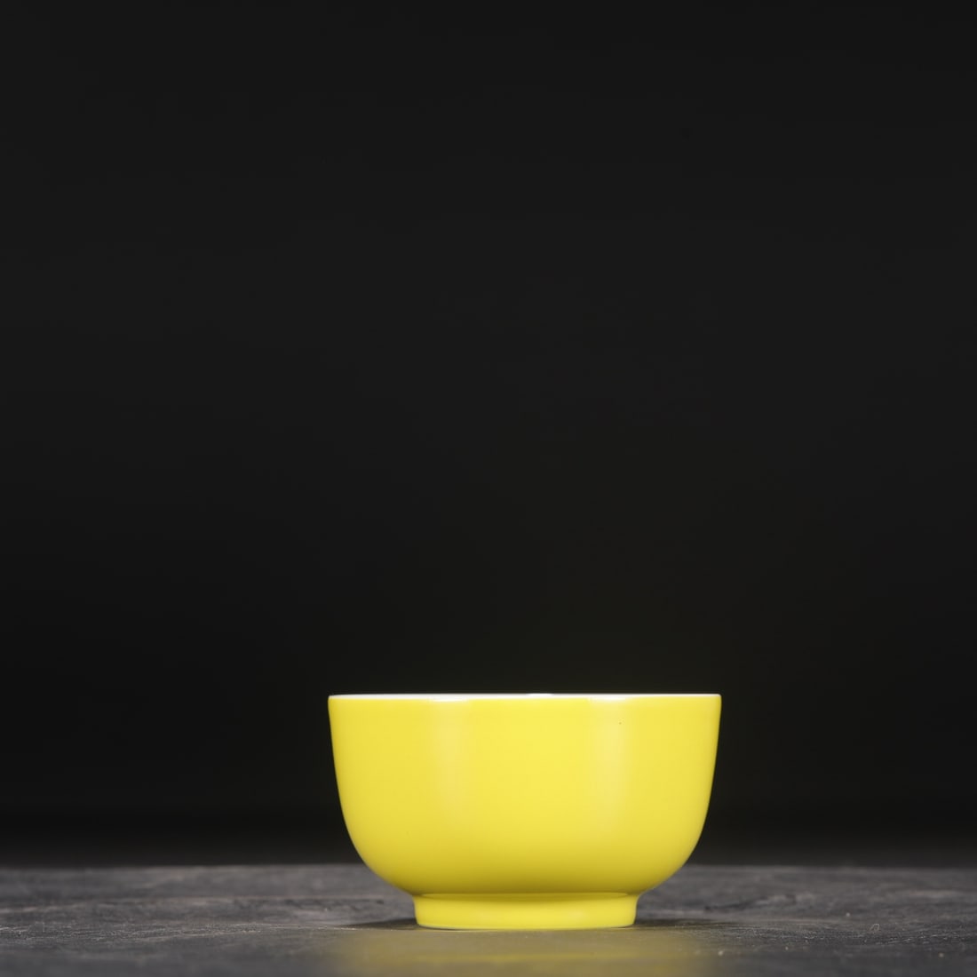 A Qing Dynasty Yongzheng period pale yellow glazed tea bowl.: Height: 5.5 cm, Diameter: 9 cm