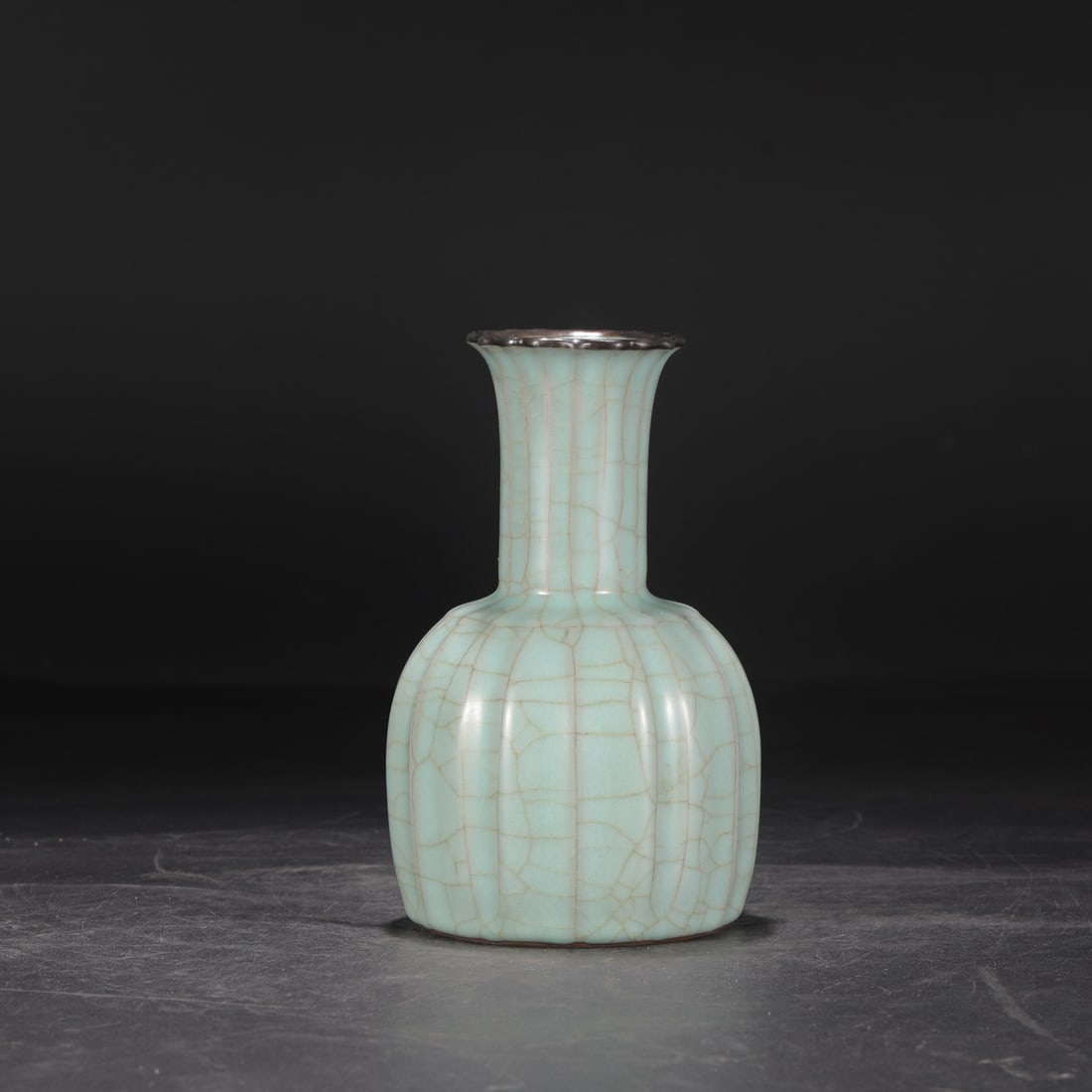A Southern Song Dynasty official kiln celadon vase with a silver rim, used in the imperial court and (1 of 7)