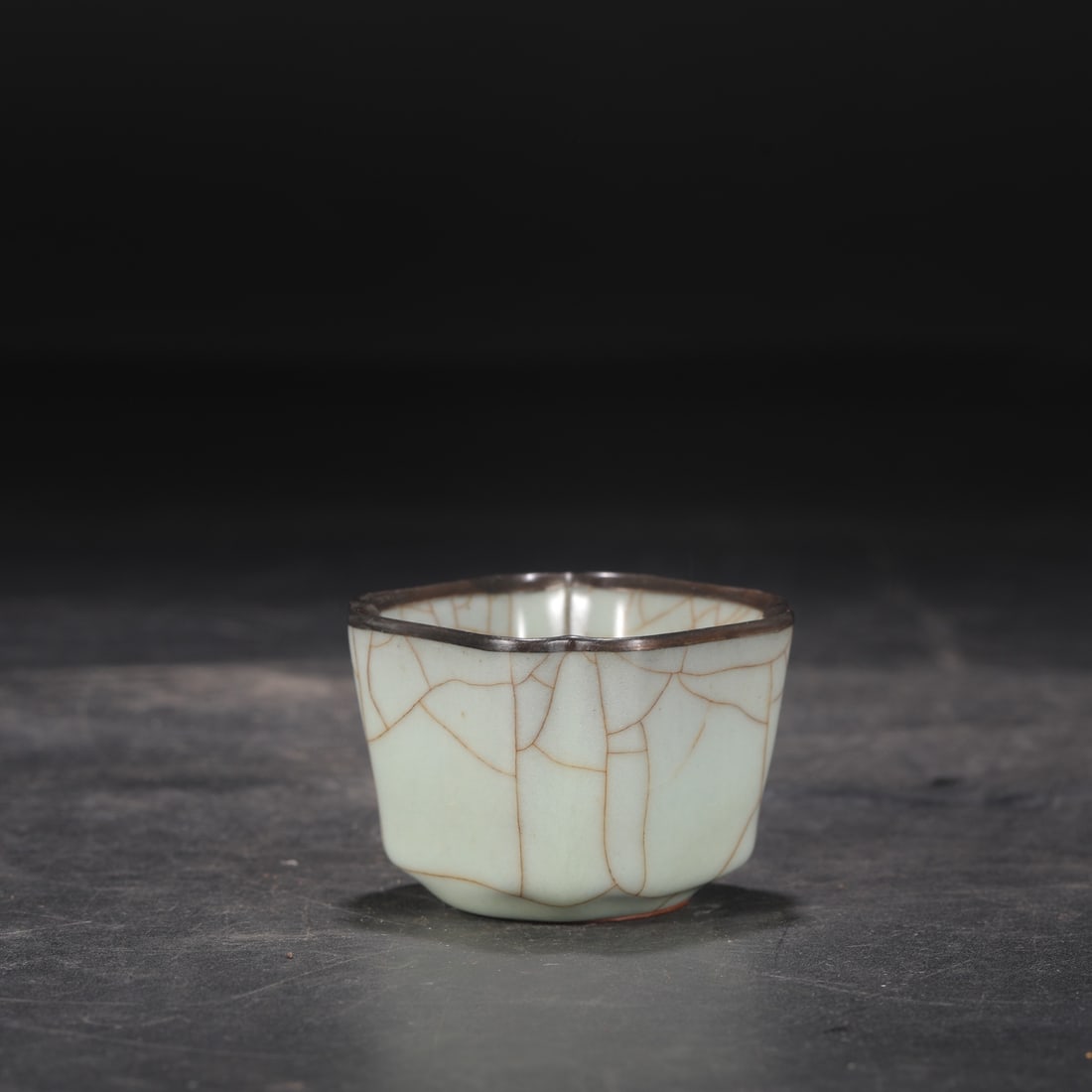 A Southern Song Dynasty official kiln celadon tea bowl with a silver rim, formerly in the: Dimensions: Height 5 cm, Mouth Diameter 6.5 cm.