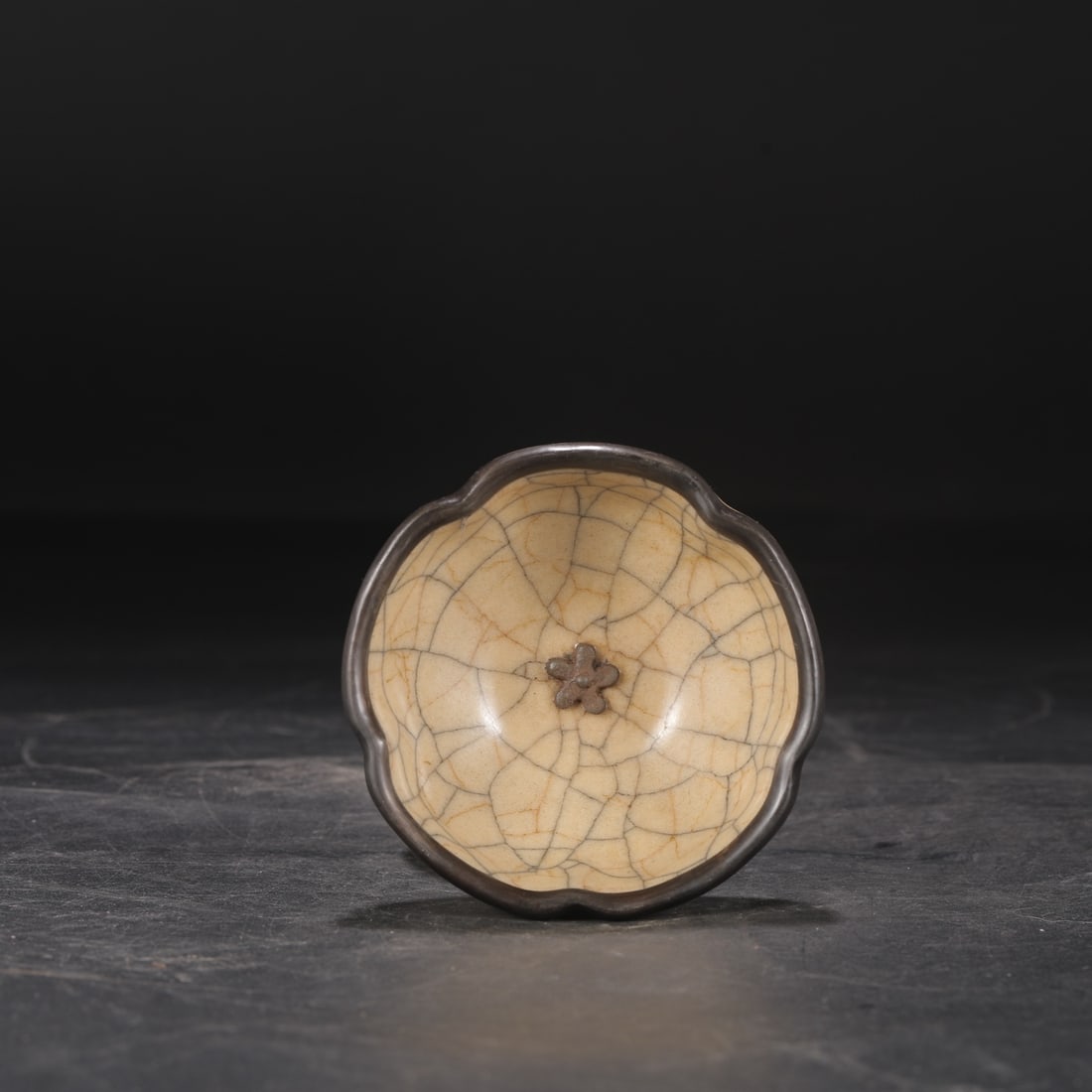 A Northern Song Dynasty Ge ware rice-yellow glazed silver-rimmed plum blossom cup, formerly from a: Dimensions: Height 5 cm, Diameter 10.5 cm.