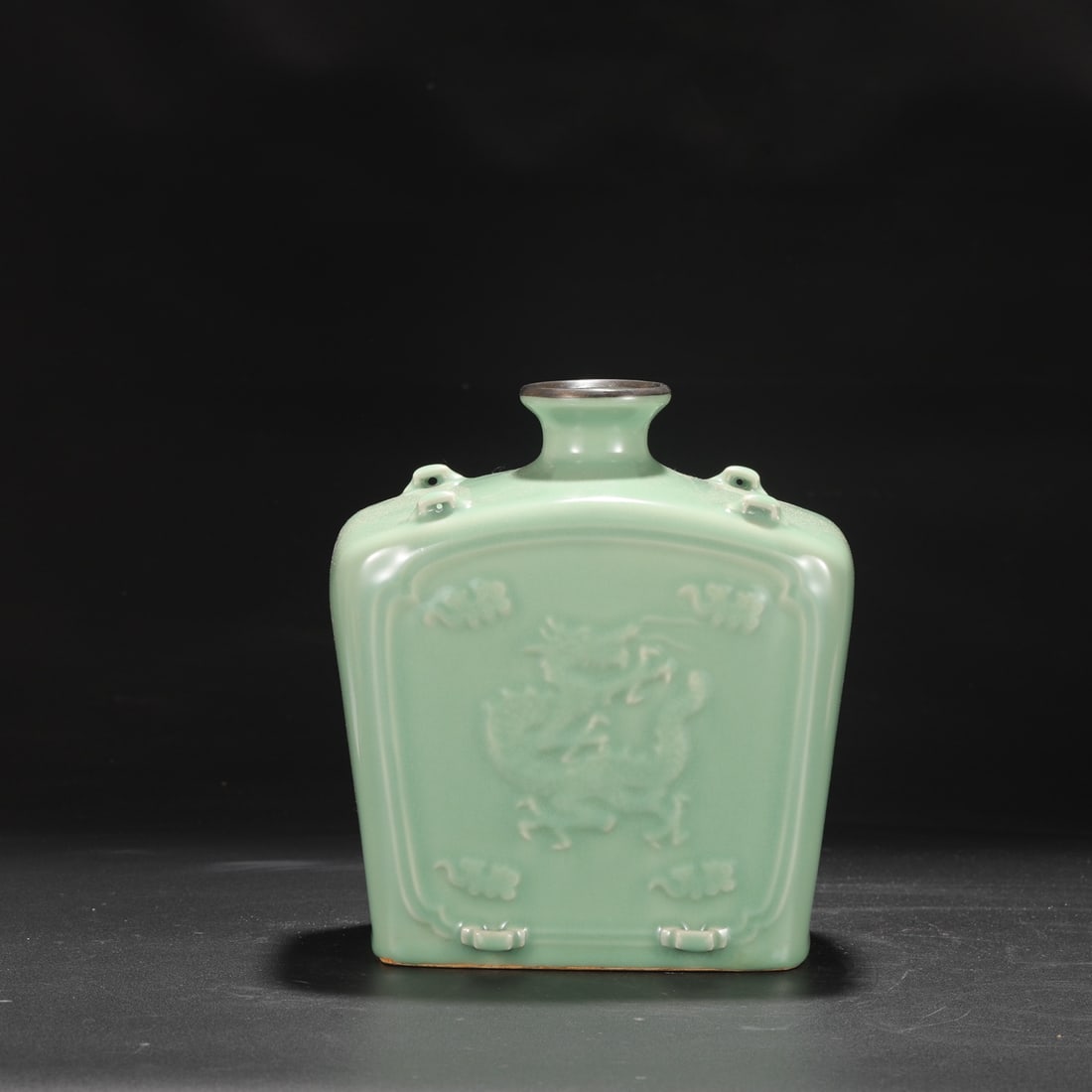 A Yuan Dynasty Longquan celadon flat bottle with silver rim and dragon design, four handles,: Dimensions: Height 24.5 cm, Mouth diameter 6.5 cm, Belly diameter 21 cm.