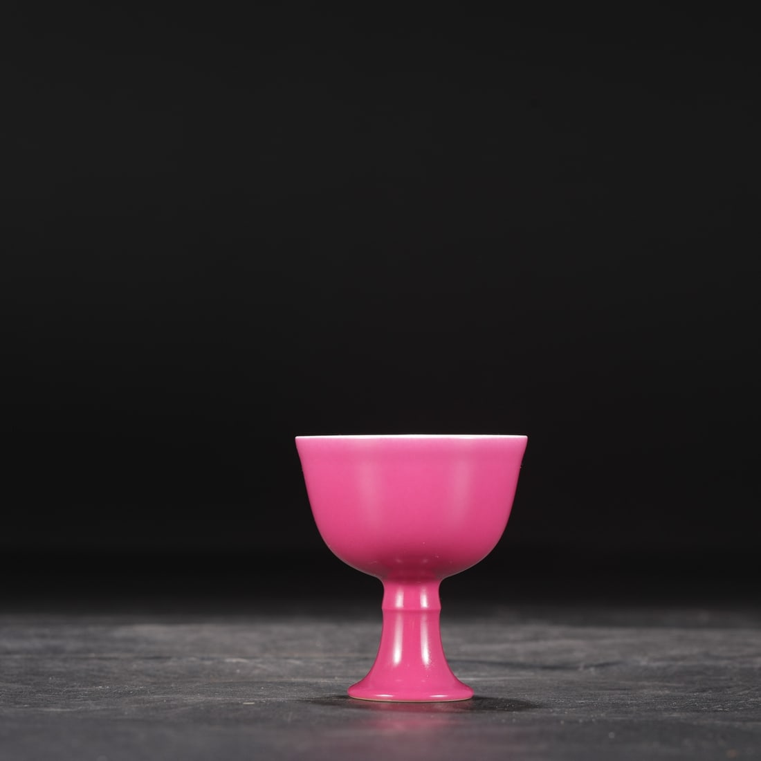 A Qing Dynasty Yongzheng period rouge-red glazed stem cup,: 7.2 cm high and 6 cm in diameter.
