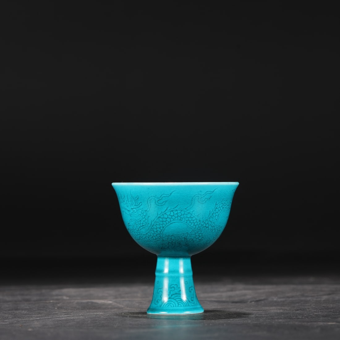 A Ming Dynasty Chenghua period peacock green glazed stem cup with incised dragon and cloud design, (1 of 7)