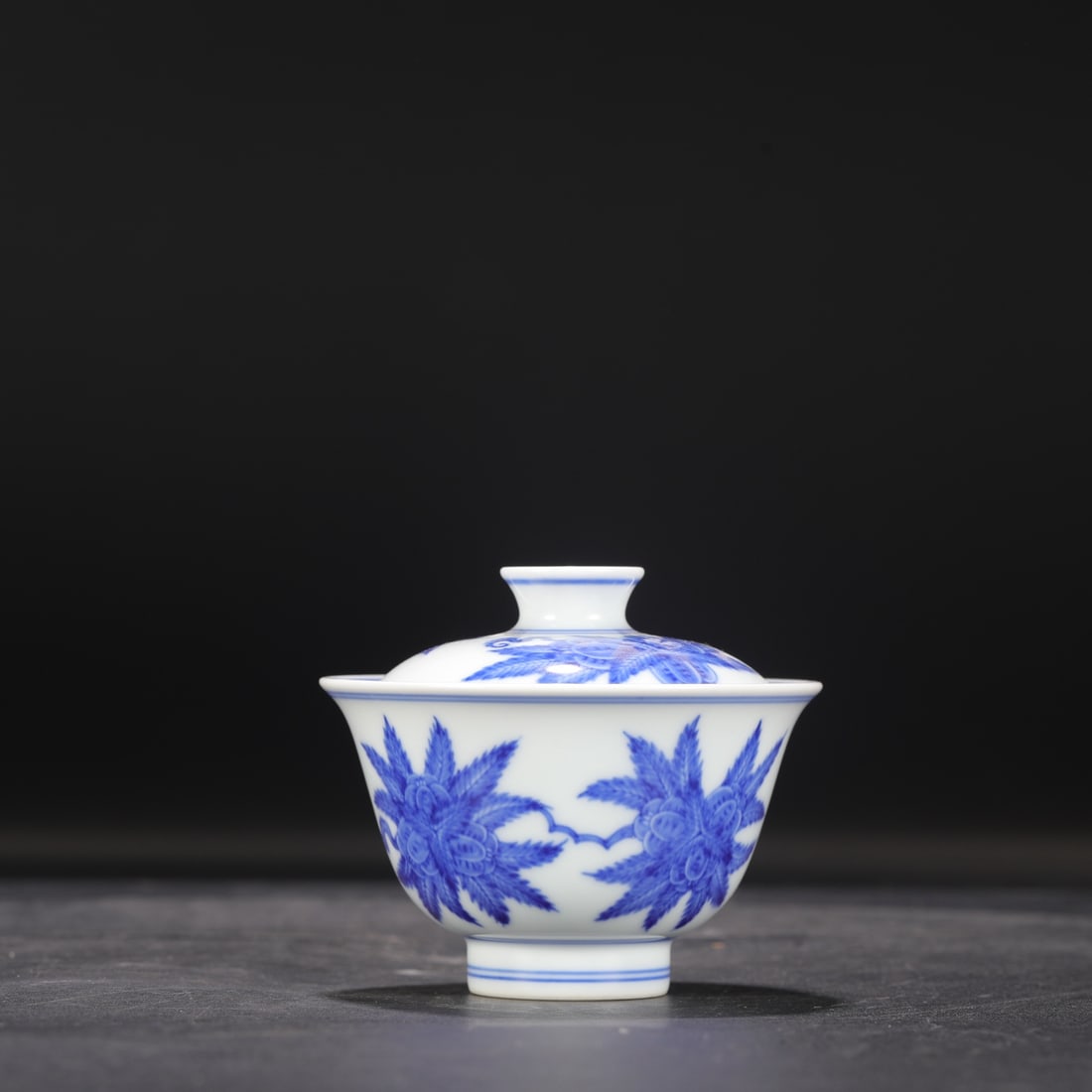 A Ming Dynasty Chenghua period blue and white porcelain tea bowl with floral and fruit design,: Dimensions: Height 8.3 cm, Mouth Diameter 9.5 cm.