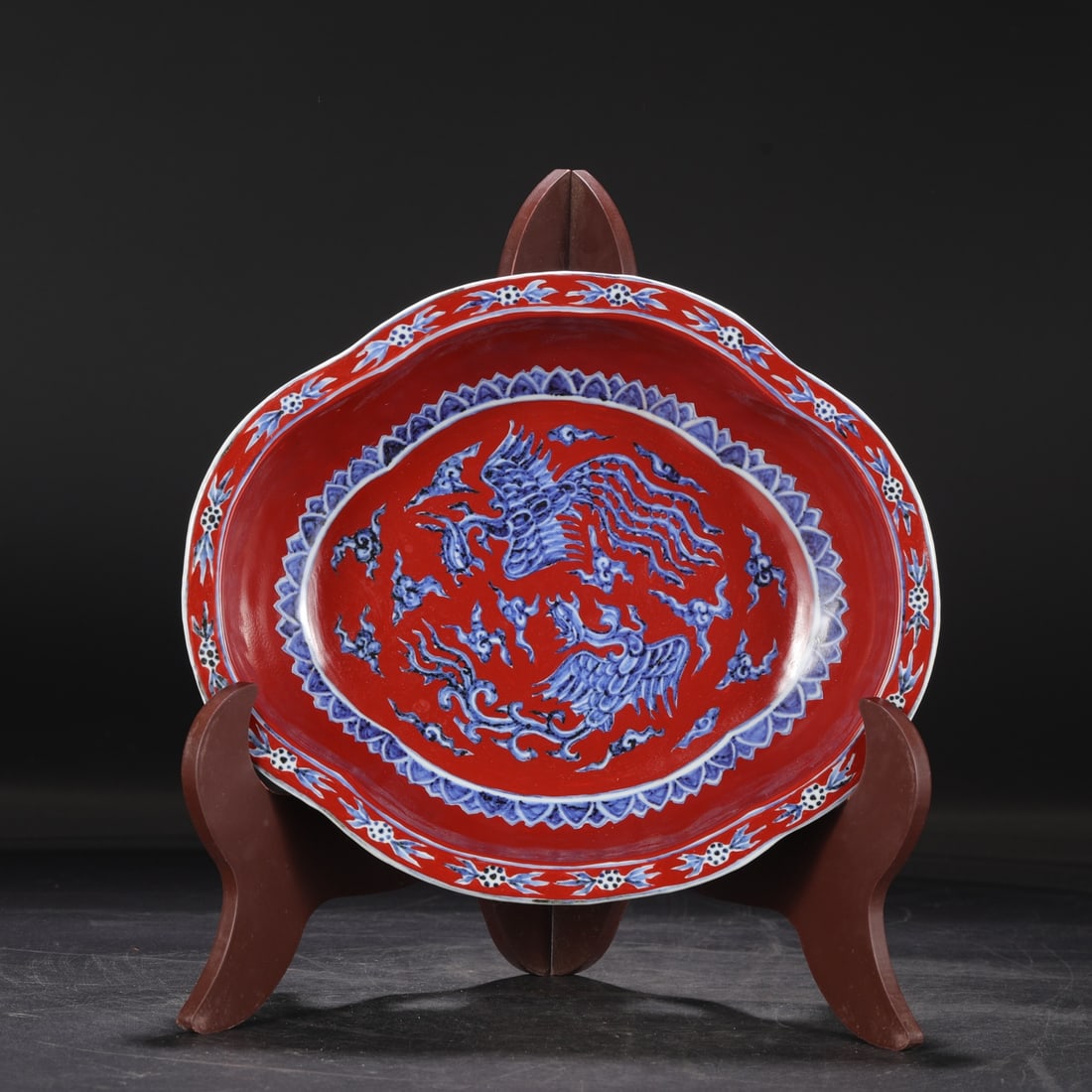 A large Ming Dynasty Xuande period red-ground blue-and-white porcelain basin with dragon and cloud (1 of 7)