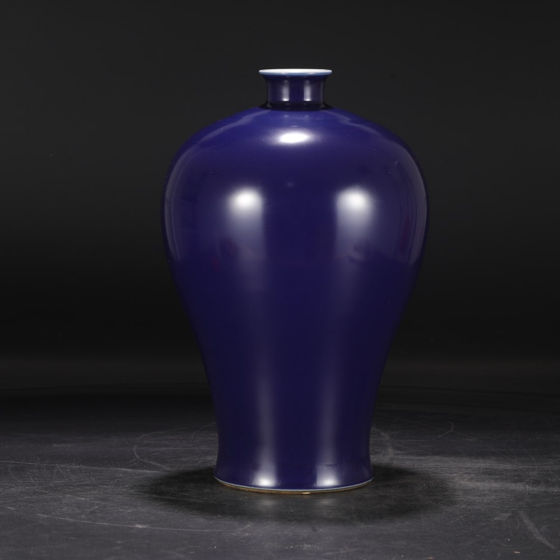 A large Qing Dynasty Kangxi period celadon-glazed plum vase, formerly in the collection.: Dimensions: Height 34 cm, Mouth diameter 5.5 cm, Belly diameter 21 cm.