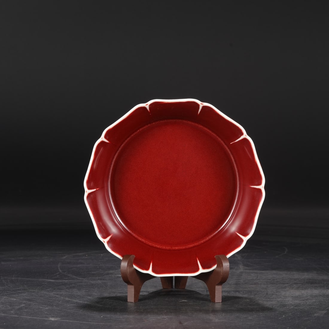 A Ming Dynasty Xuande period gem-red glazed ten-lobed dish/washer, formerly in the collection.: Dimensions: Height 5.5 cm, Diameter 19 cm.