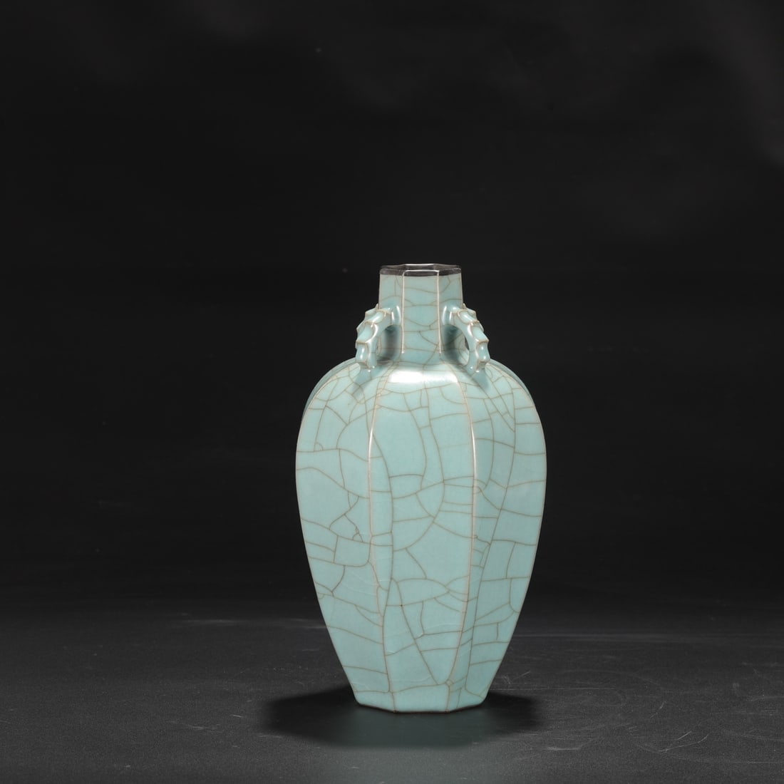 A large Southern Song Dynasty official kiln celadon vase with a silver rim and four handles, used in: Dimensions: Height 26.5 cm, Mouth diameter 4.5 cm, Belly diameter 14 cm.