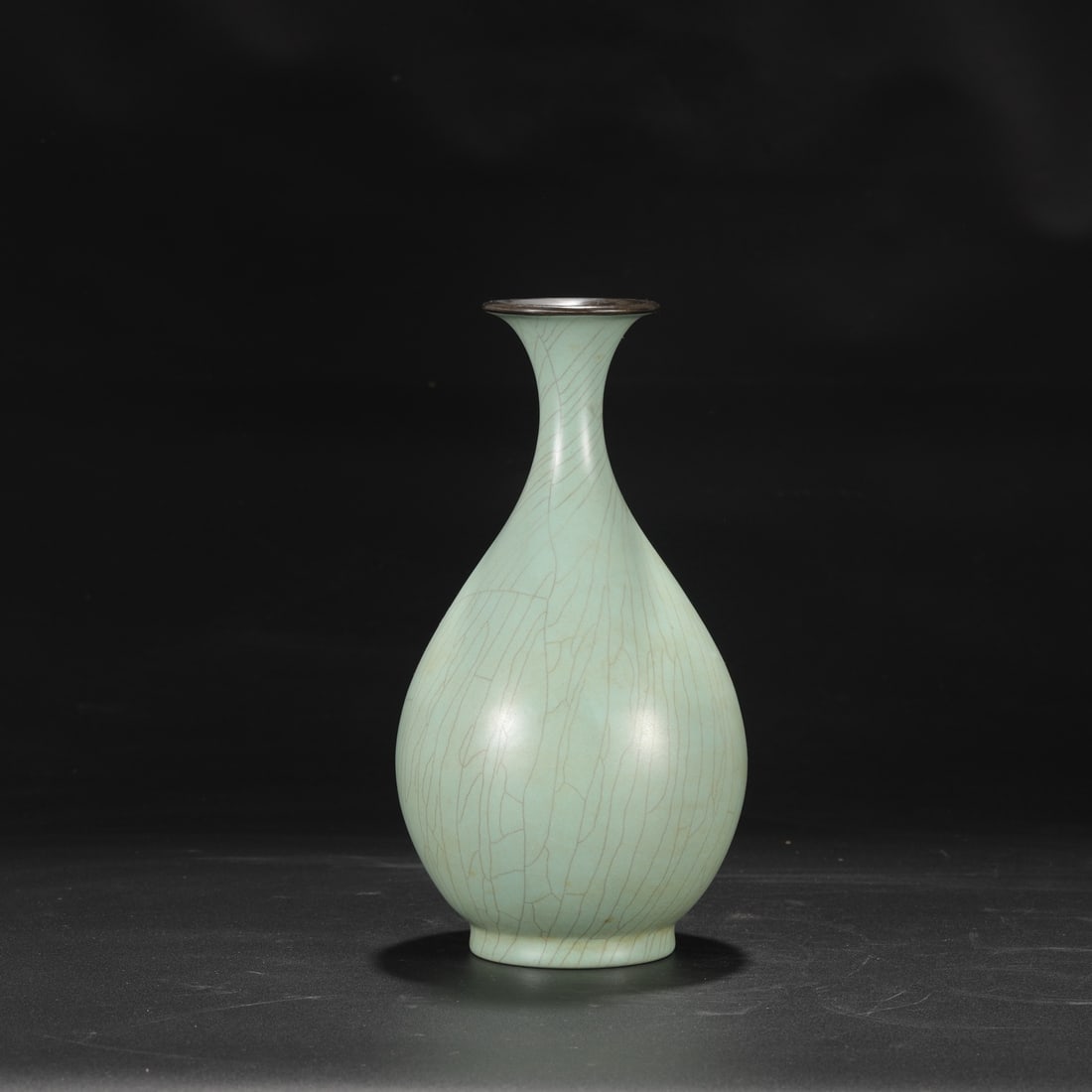 A large Ru ware celadon vase with a silver rim, formerly in the collection, used by the Qianlong: Dimensions: Height 23.5 cm, Mouth diameter 5 cm, Belly diameter 13.5 cm.