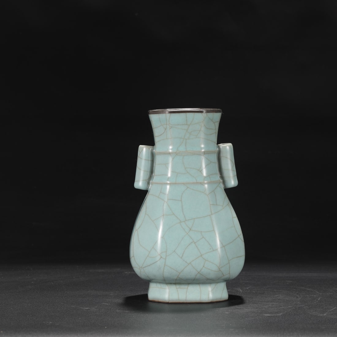 A Southern Song Dynasty official kiln celadon vase with a silver rim, used in the imperial court,: Dimensions: Height 22.5 cm, Mouth Diameter 8.5 cm, Belly Diameter 13 cm.