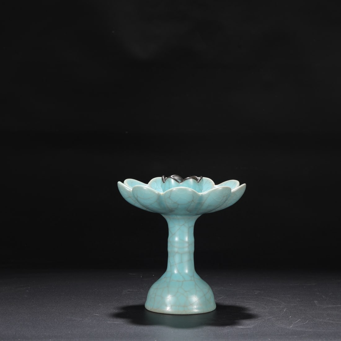 A Northern Song Dynasty Ru ware sky-blue glazed candlestick with ice-crack pattern and silver rim,: Dimensions: Height 18 cm, Diameter 16.5 cm.