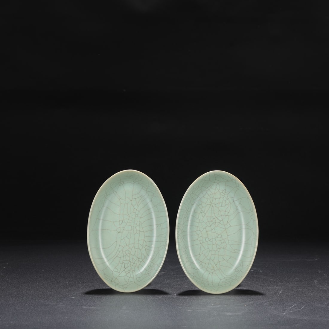 A pair of Northern Song Dynasty Ru ware celadon-glazed imperial duck egg washers, formerly from a: Dimensions: Height 2.5 cm, Diameter 15 cm.