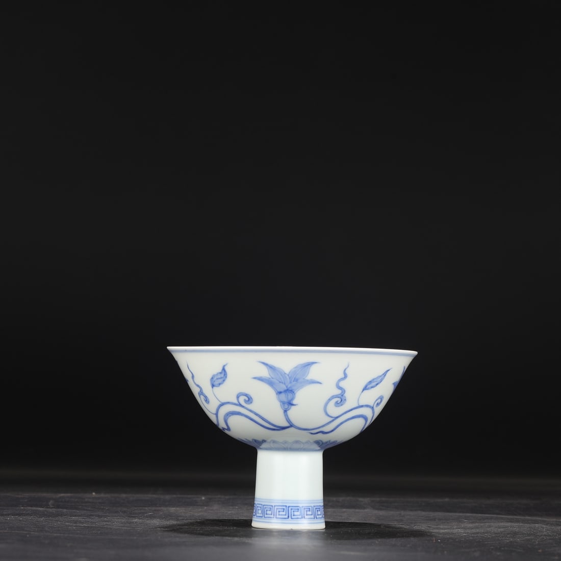 A Ming Dynasty Chenghua blue and white porcelain stem bowl with a scrolling floral design, formerly: Dimensions: Height 11 cm, Diameter 15 cm.