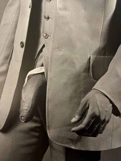 Robert Mapplethorpe "Man in Polyester Suit, 1980": Robert Mapplethorpe (1946-1989) was an American photographer, known for his provocative and controversial black-and-white photographs that often explored themes of sexuality, gender identity, and the