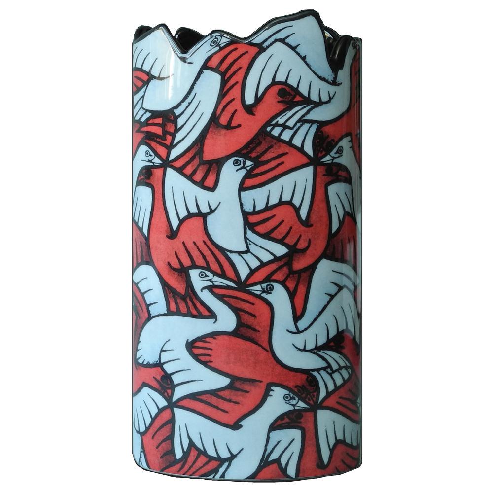 M.C. Escher Ceramic Vase: M.C. Escher, born Maurits Cornelis Escher in 1898 in the Netherlands, was a Dutch graphic artist known for his mind-bending and mathematically inspired artwork. His work explores concepts of infinity,