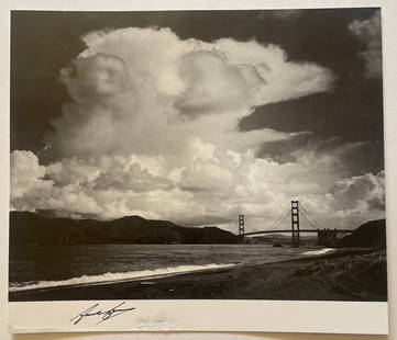 Ansel Adams Signed "The Golden Gate Bridge from Bakers Beach, San Francisco, CA, 1953" Print: Ansel Adams (1902-1984) was an American photographer and environmentalist known for his stunning black-and-white landscape photographs of the American West, particularly Yosemite National Park. He was