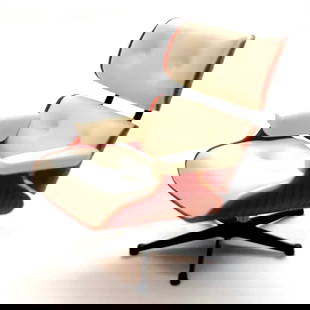 Eames White Lounge Chair Desk Display: The Eames Lounge Chair and Ottoman, often simply referred to as the "Eames Chair," is an iconic piece of furniture designed by the American design duo Charles and Ray Eames. Here are some key details