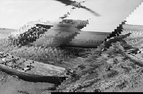 Vietnam War "Huey, Wounded Vietnamese Soldier" Photo Print: The Vietnam War was a complex and controversial conflict that took place in Vietnam from November 1, 1955, to April 30, 1975. It was a significant and divisive event in both Vietnamese and American hi