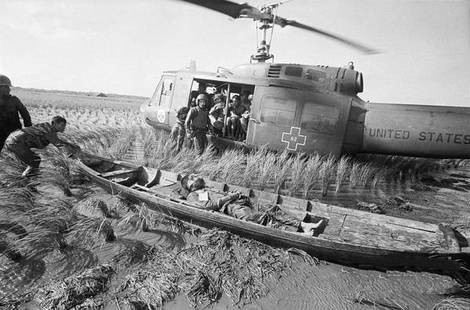 Vietnam War "Huey, Wounded Vietnamese Soldier" Photo Print: The Vietnam War was a complex and controversial conflict that took place in Vietnam from November 1, 1955, to April 30, 1975. It was a significant and divisive event in both Vietnamese and American hi