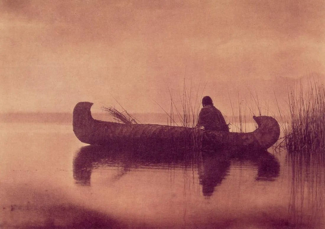 EDWARD CURTIS "Kutenai Duck Hunter, 1910"Print: Edward S. Curtis (1868-1952) was an American photographer and ethnologist known for his monumental project, "The North American Indian." This project aimed to document and preserve the cultures, tradi