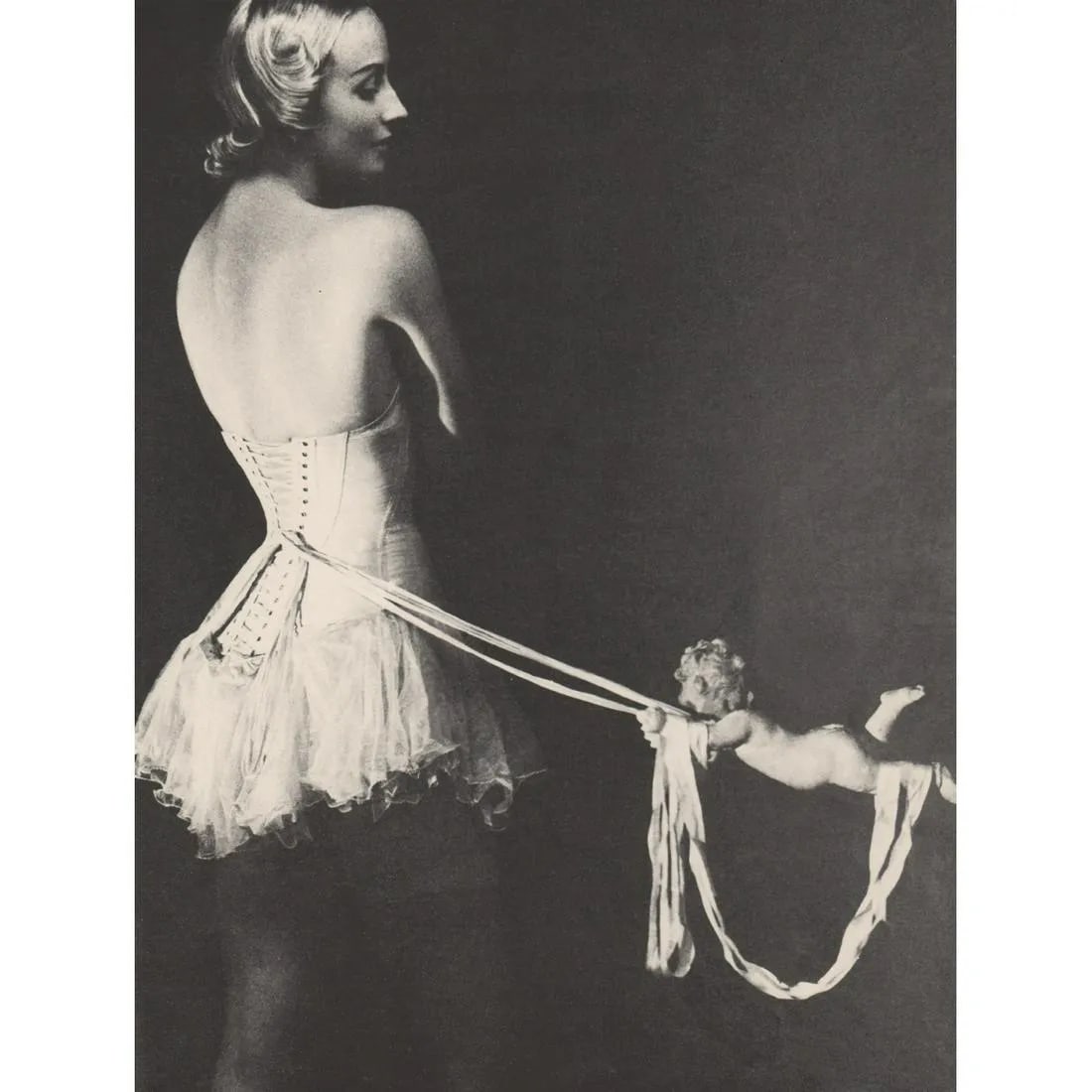 ERWIN BLUMENFELD "The Mainbocher Corset, 1939" Print: Erwin Blumenfeld was a highly influential American photographer known for his work in fashion photography, portraiture, and experimental photography. "The Mainbocher Corset, 1939" is one of his iconic