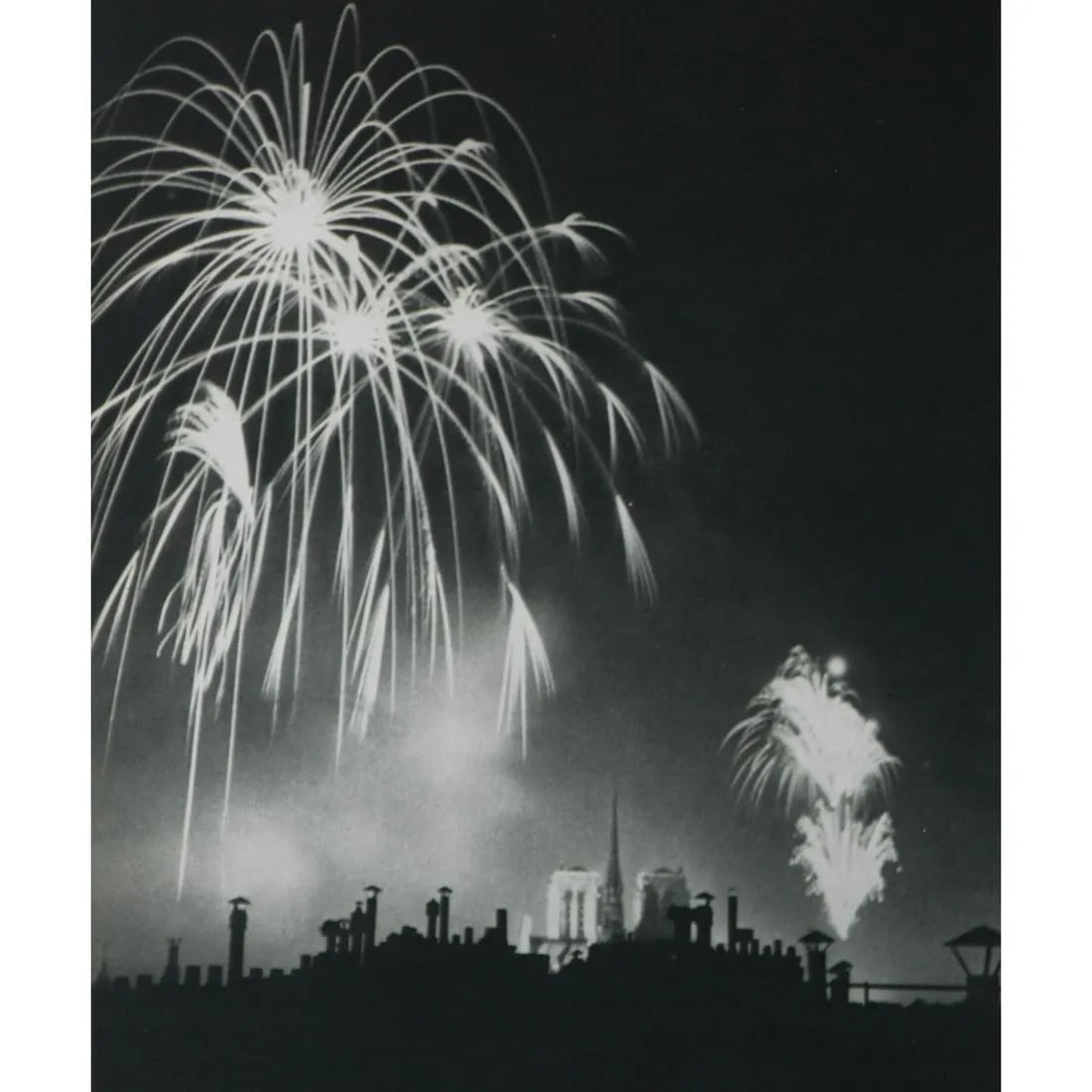 BRASSAI "Fireworks over Notre Dame"Print": BrassaÃ¯, whose real name was Gyula HalÃ¡sz, was a Hungarian-French photographer known for his evocative and atmospheric images of Paris, particularly its nightlife and urban landscapes. He was ac