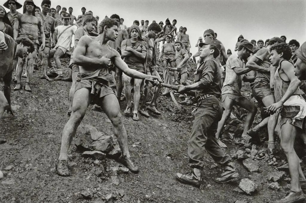SEBASTIAO SALGADO "Dispute Among Workers, Brazil, 1986" Print: SebastiÃ£o Salgado is a renowned Brazilian photographer known for his impactful documentary work, particularly in capturing the lives of workers and marginalized communities around the world. The ph
