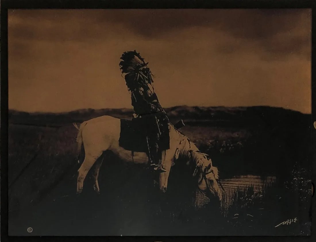 Edward Curtis "Goldtone Glass Photograph (Oasis)" Print: Edward S. Curtis's goldtone glass photograph titled "Oasis" is an example of his extensive body of work that documented the indigenous peoples of North America in the late 19th and early 20th centurie